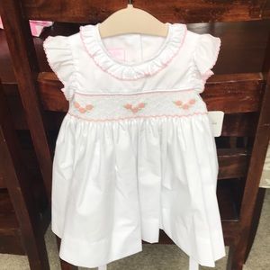 White dress with pink smocking